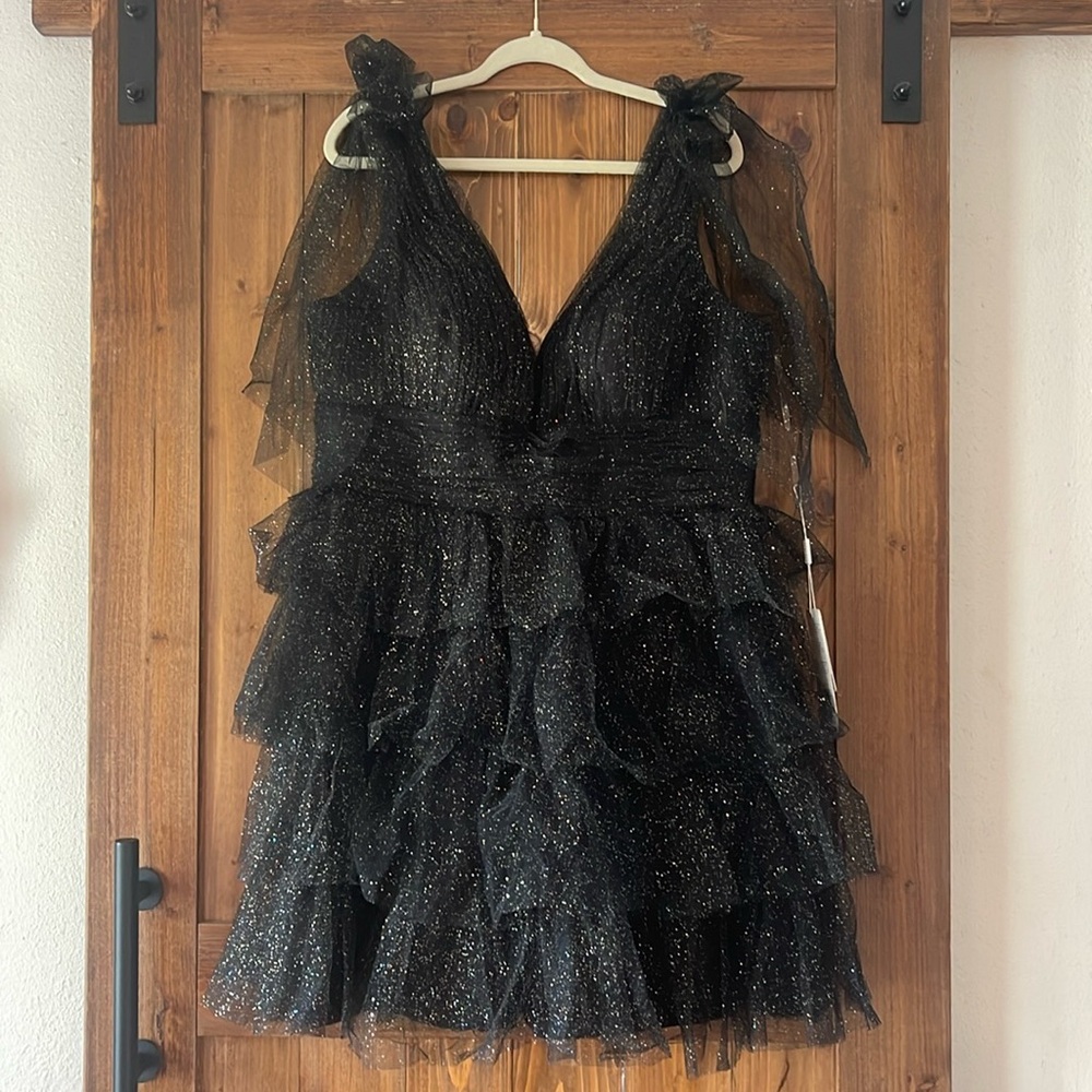 Homecoming dress black with glitter comes down to about your knee